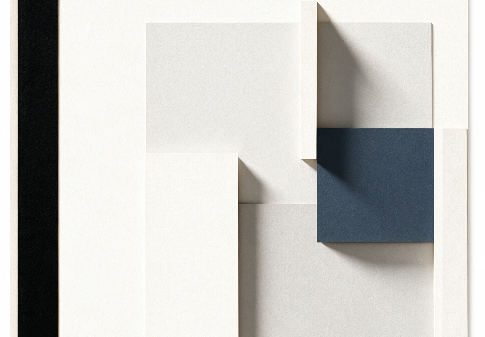 Paper relief of overlapping stone panels with a single slate square
